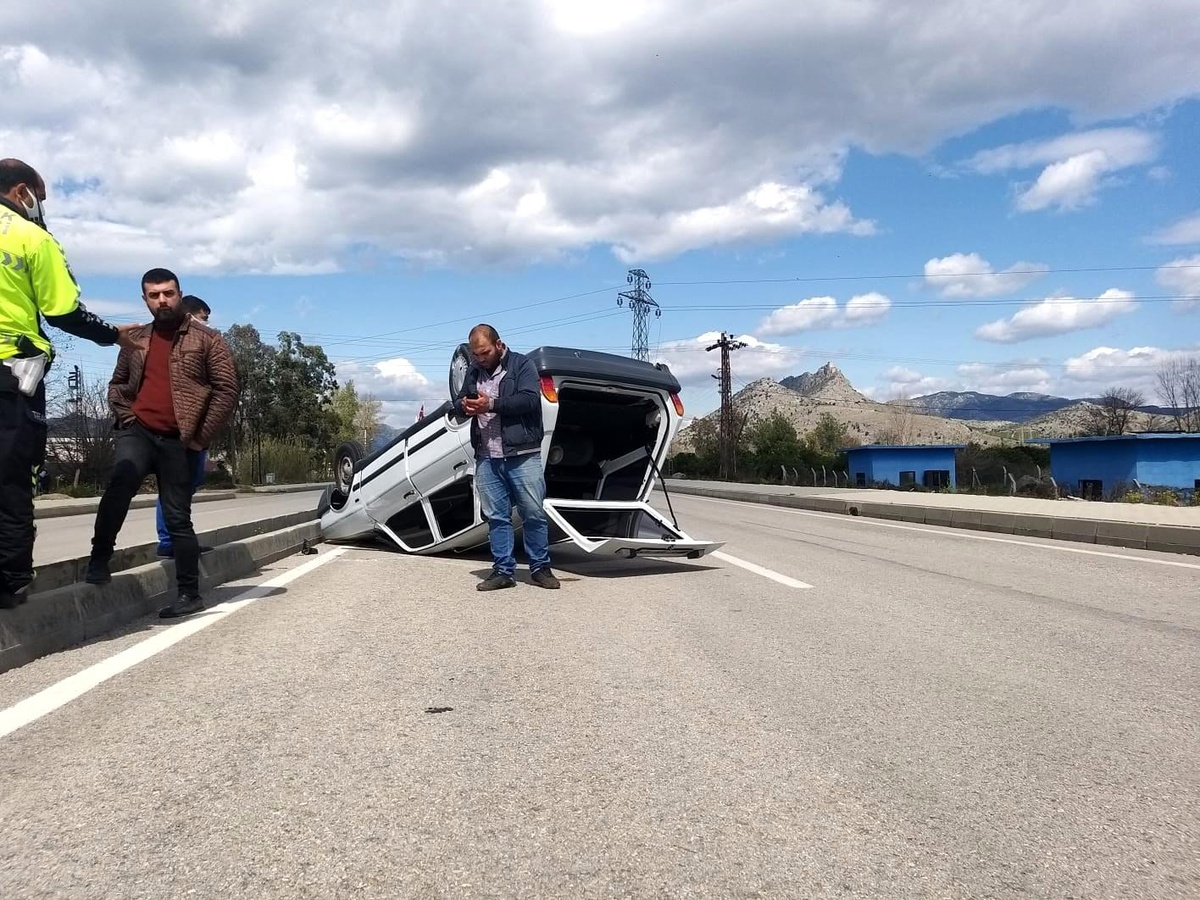 Takla atan otomobilden hafif yaralı kurtuldu