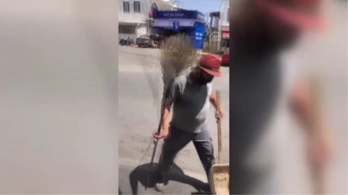 Bodrum\'da süpürgesiyle akrobatik hareketler yapan temizlik işçisi gülümsetiyor