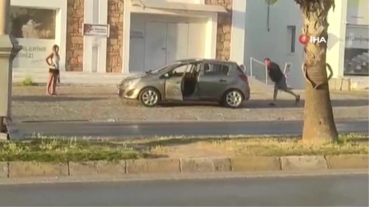 Eşi ve çocuğunun gözü önünde kendi arabasına taşla saldırıp, muhabiri darp etti
