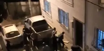 Bursa'da ailelerin taşlı- sopalı kavgası kamerada