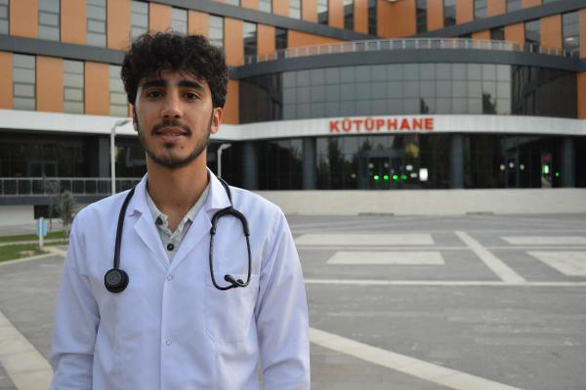 A medical student studies in the library where he was a worker in construction once