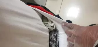 Havalimanında vücuduna sarılı uyuşturucu ile yakalandı