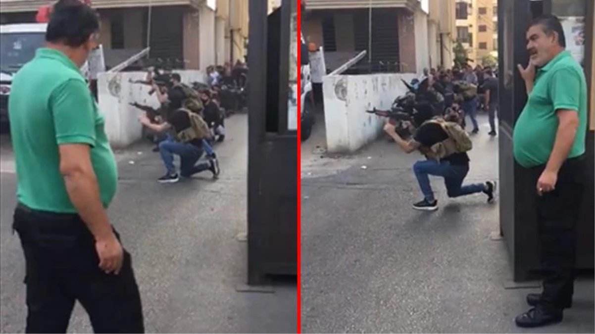 Beyrut\'taki silahlı çatışmaların ortasında kalan adam rahat tavırlarıyla dikkat çekti