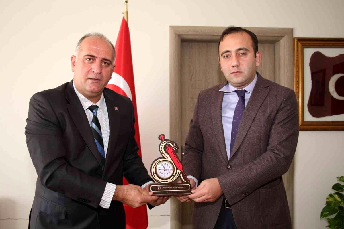 Özden Oltu Kaymakamı Bakkal\'a ziyaret etti