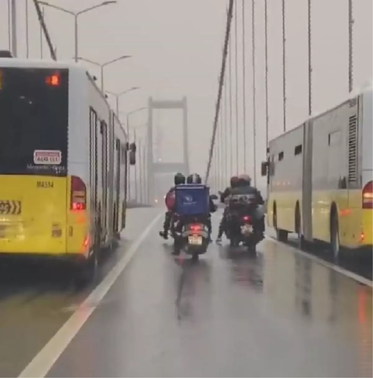 2 bus guards the 4 motorcycles on 15 Temmuz Sehitler Bridge