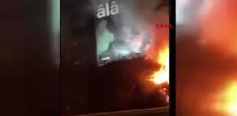 Son dakika haber: Şişli'de, ağaçlık alanda çıkan yangın binanın reklam afişine sıçradı