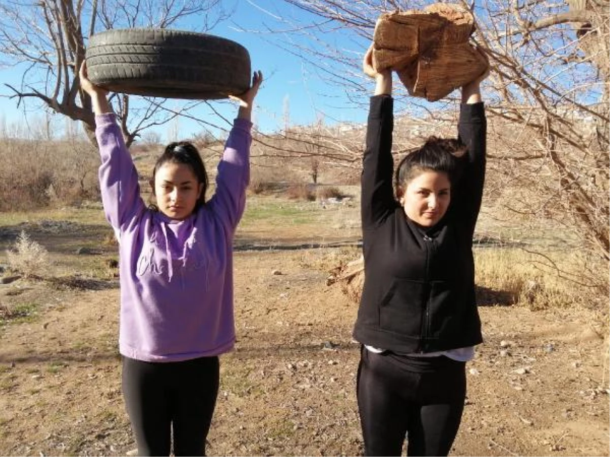 Weight-lifter sisters are preparing for the Turkish championship with tire and log