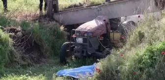 Manisa'da çarptığı kanalet üzerine devrilen traktör sürücüsü hayatını kaybetti