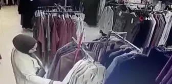 Deneme bahanesiyle kabine girdi, iki tane trençkotu böyle çaldı