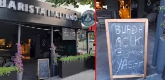 'Açık giyinmek yasak' yazısı olan kafede şort giyen genç kızları dışarı çıkartan personelin işine son verildi