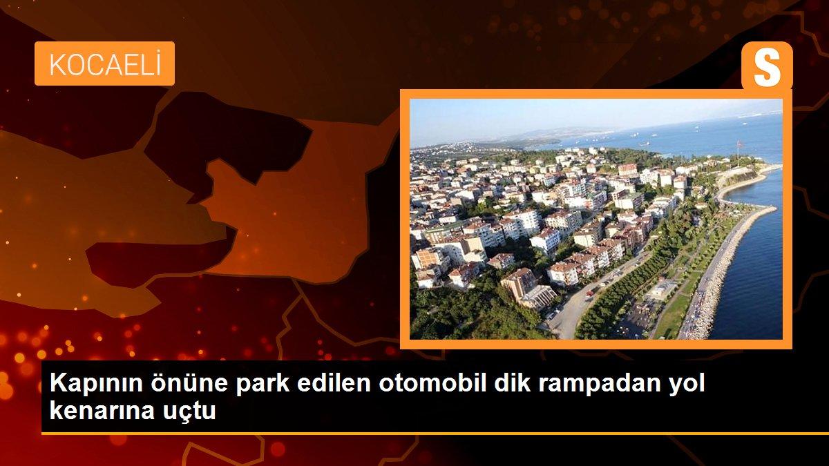 Kapının önüne park edilen otomobil dik rampadan yol kenarına uçtu