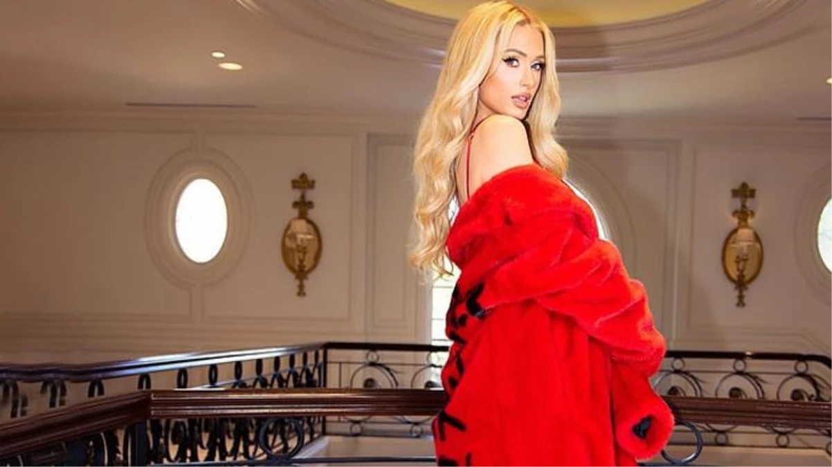 Sosyetik güzel Paris Hilton\'un kırmızı Noel elbisesiyle verdiği pozlar nefes kesti