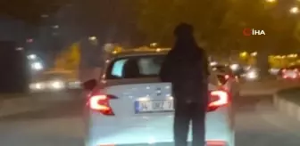 Canını hiçe saydı, metrelerce yolu araca tutunarak ilerledi