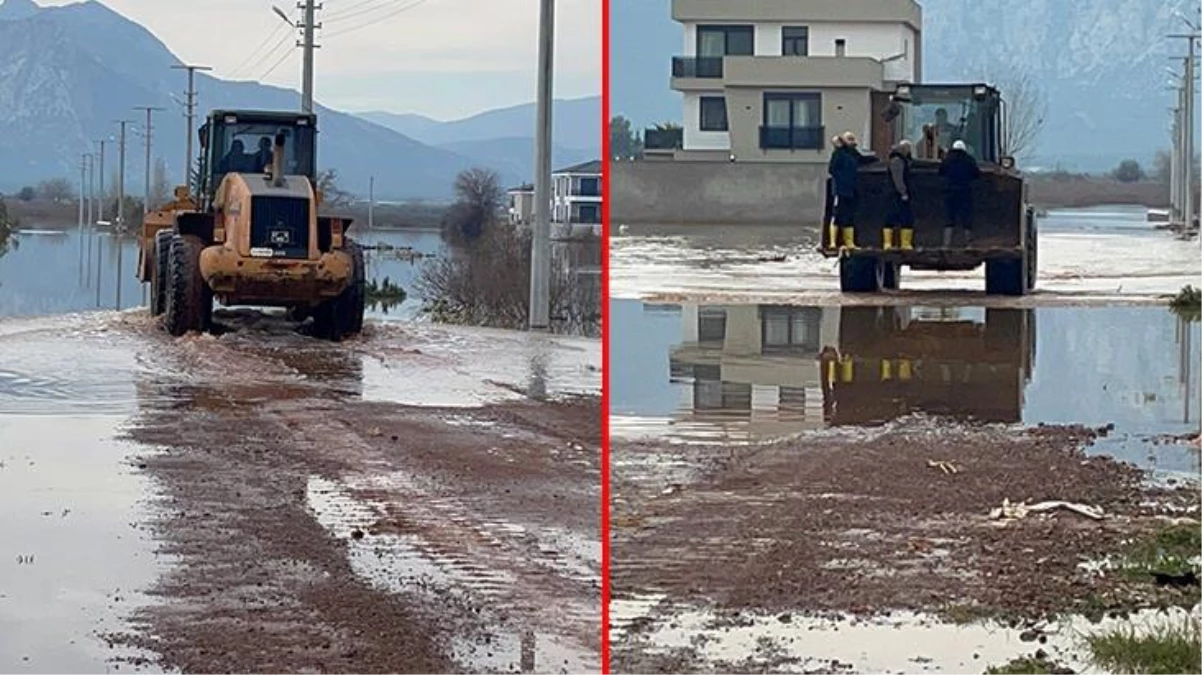Antalya\'da yağmur suları nedeniyle evlerinden çıkamayanlar iş makinasıyla taşınıyor