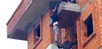 İntihar girişiminde bulunduğu binada dakikalarca asılı kaldı