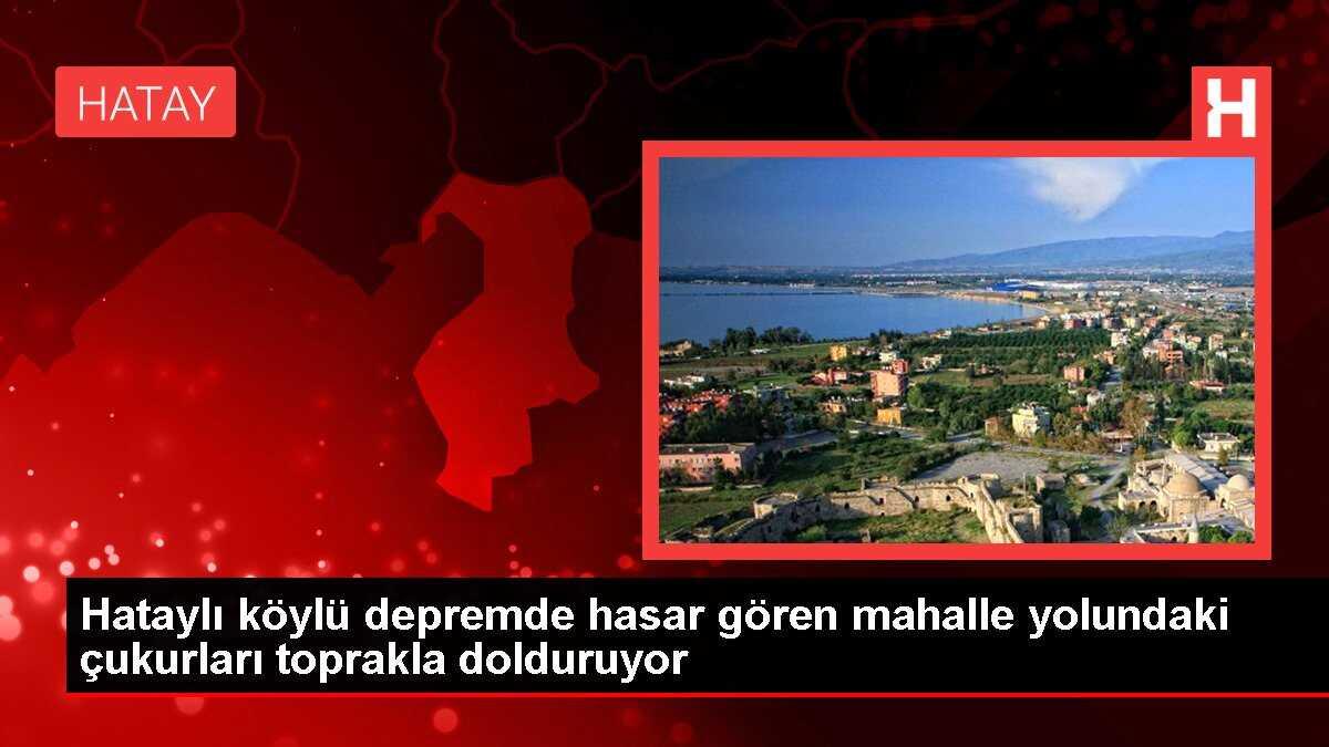 Hataylı köylü depremde hasar gören mahalle yolundaki çukurları toprakla dolduruyor