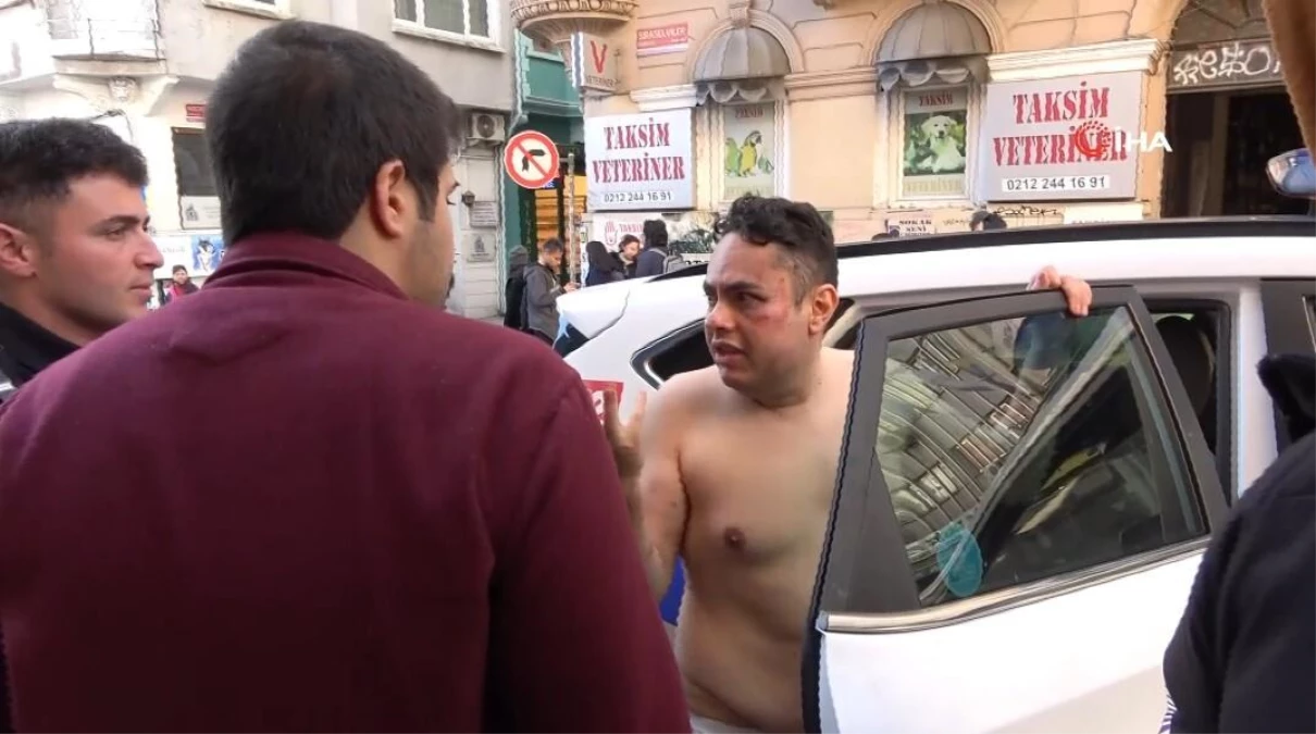 Taksim\'de yarı çıplak halde otel ve iş yerlerine girmek isteyen İspanyol turist, ortalığı birbirine kattı