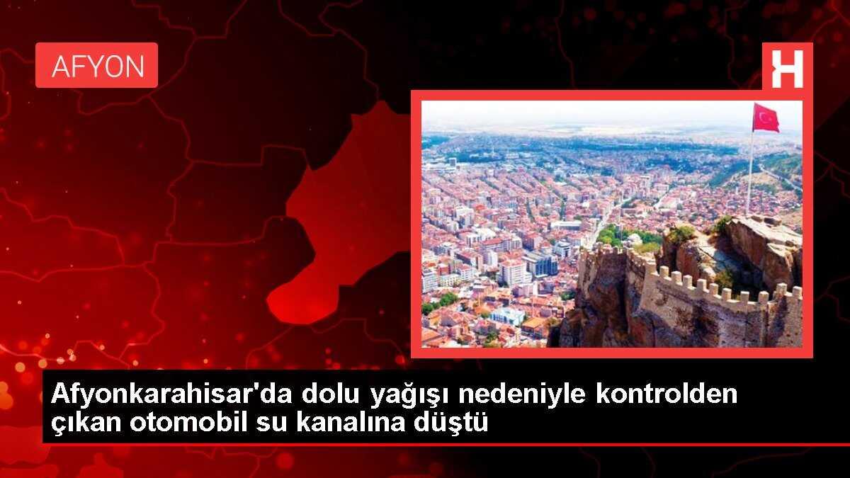 Afyonkarahisar'da dolu yağışı nedeniyle otomobil su kanalına düştü