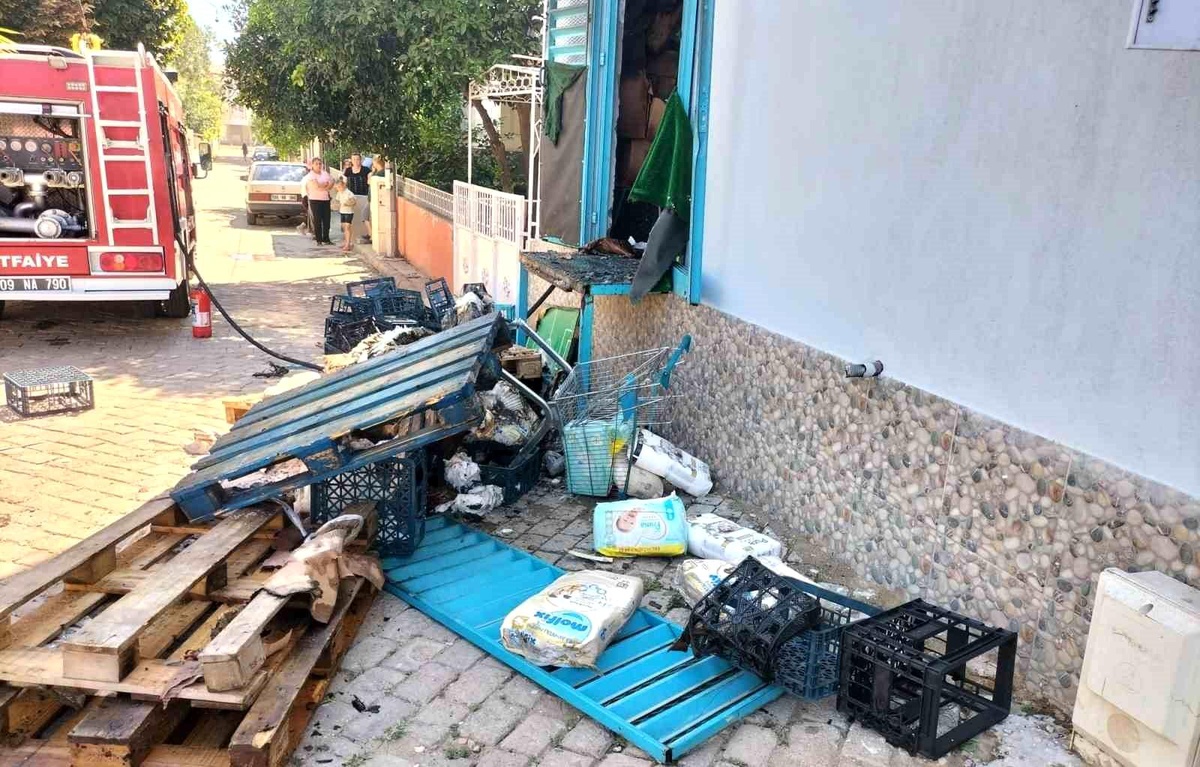 Nazilli\'deki bir markette çıkan jeneratör yangınında maddi hasar meydana geldi