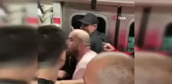 Metroda tartıştığı kadın yolcuya vuran şahsa vatandaş tepkisi kamerada