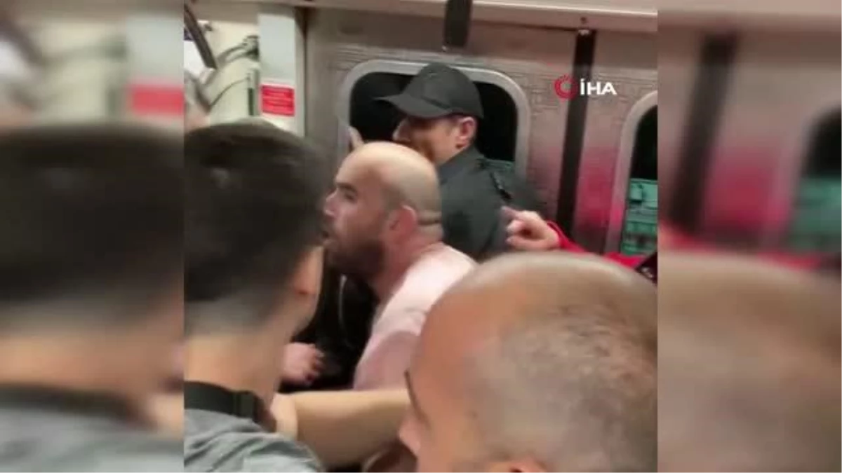Metroda tartıştığı kadın yolcuya vuran şahsa vatandaş tepkisi kamerada