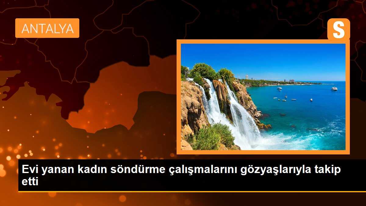 Evi yanan kadın söndürme çalışmalarını gözyaşlarıyla takip etti