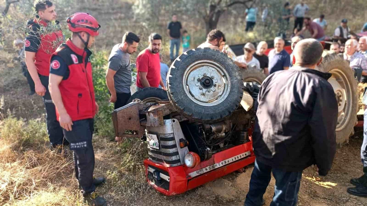Edremit\'te takla atan traktörün altında kalan sürücü çevre sakinleri tarafından kurtarıldı