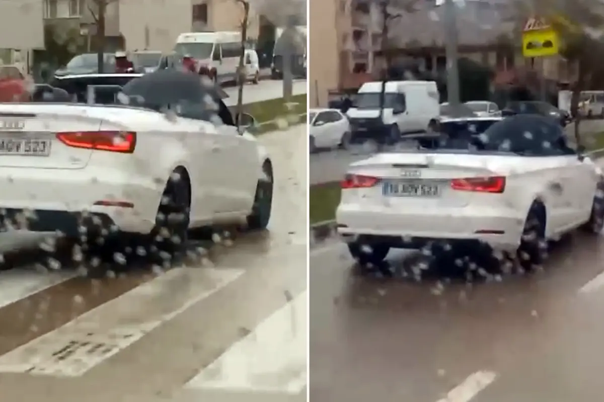 Milyonluk arabada ıslanmamak için şemsiye açtı