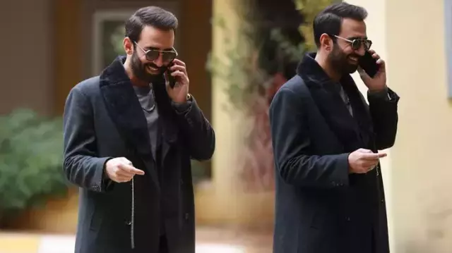 Ferit Kaya hayranlarıyla fotoğraf çektirirken eşinin bakışları dikkat çekti